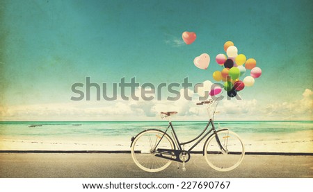 Paper Card of bicycle vintage with heart balloon on beach blue sky concept of love in summer and wedding honeymoon
