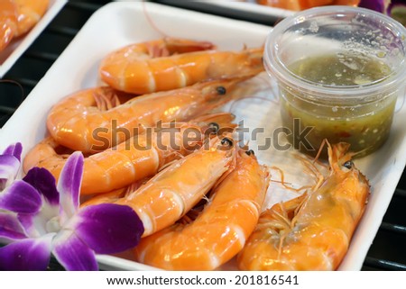 Shrimp with sauce on the evening market. Thailand.