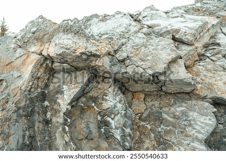 Similar – Foto Bild Felsen, der unter Wolkenverhangenem Himmel mickrig klein wirkt.