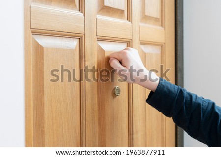 person hand knock the door, visit the friends house Foto d'archivio © 
