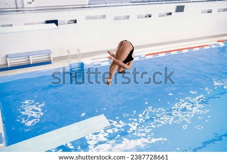 Similar – Image, Stock Photo Girl dives in the pool, in the blue water.
