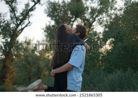 Similar – Image, Stock Photo Blue hour, happy laughter: Woman with short hair looks into the camera with amusement