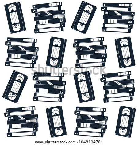 Seamless pattern with retro video cassettes. Vector illustration.