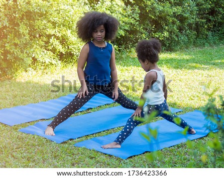 Similar – Image, Stock Photo Two beautiful sisters do their homework during quarantine. Children use gadgets for learning. Education, distance learning, home schooling during quarantine