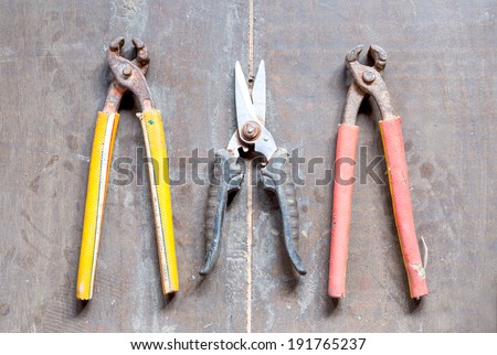 combination cutting pliers on wood floor