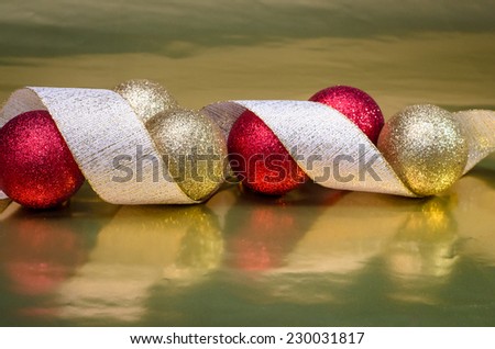 red ball and ribbon over shining background