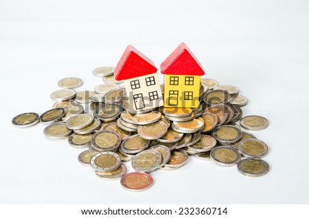 coins in pile and house isolated image