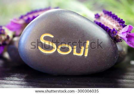 black lava stone with words soul and purple lavender flower