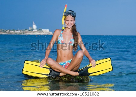 Girl in a diving mask and diving flippers