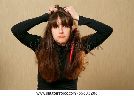 Frustrated young woman having a bad hair day
