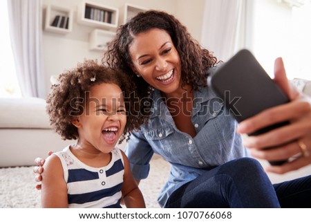 Similar – Image, Stock Photo Happy ethnic mother taking selfie with kid