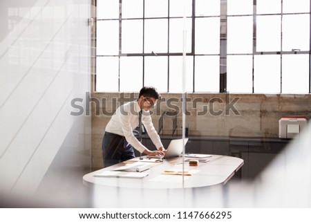 Similar – Image, Stock Photo Contemplative Asian man leaning on hand against brick building