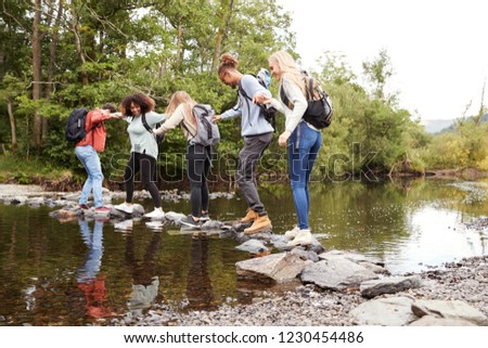 Similar – Menschen, die einen Fluss mit dem Kajak überqueren