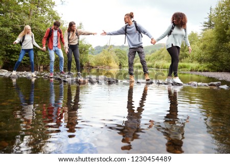 Similar – Menschen, die einen Fluss mit dem Kajak überqueren