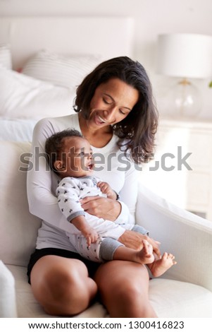 Similar – Image, Stock Photo 3 month old baby doing tummy time; bohemian interior room with houseplants