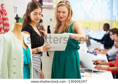 Two Women Meeting In Fashion Design Studio