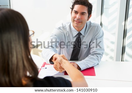 Businessman Interviewing Female Candidate For Job