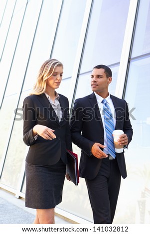 Businesspeople With Takeaway Coffee Outside Office