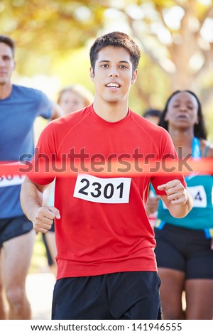 Male Runner Winning Marathon
