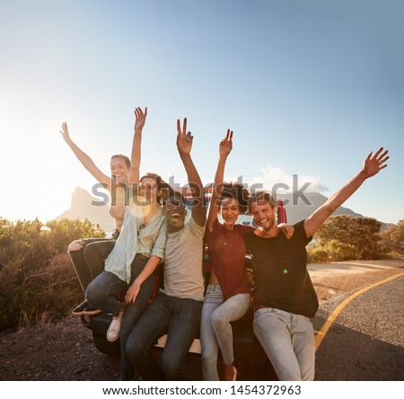 Similar – Image, Stock Photo Adventurer leaning on the door of an off-road car