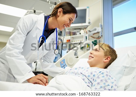 Boy Talking To Female Doctor In Emergency Room