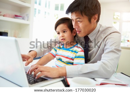 Similar – Image, Stock Photo Father working on laptop while child playing on kitchen floor