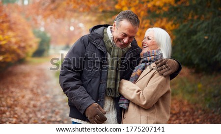 Similar – Image, Stock Photo Senior couple in autumn park
