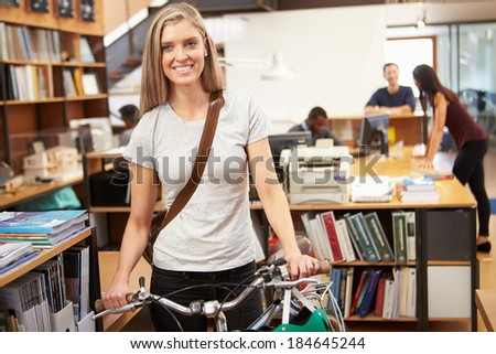 Architect Arrives At Work On Bike Pushing It Through Office