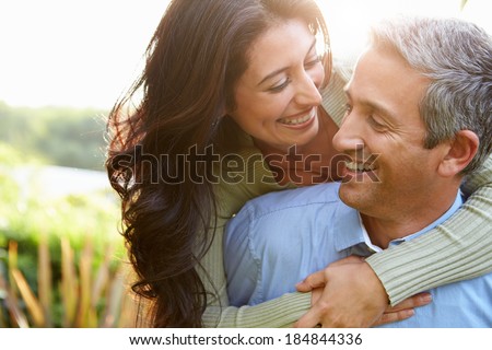 Similar – Image, Stock Photo Happy couple embracing on window sill at home