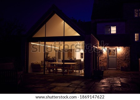 Exterior View Of Beautiful Kitchen Extension At Night Stockfoto © 