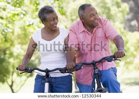 Senior couple on cycle ride in countryside