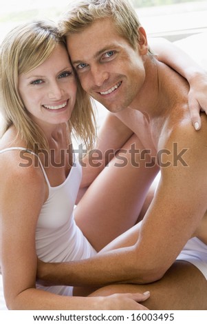 man and women cuddling indoors