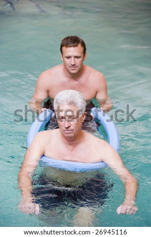Instructor And Patient Undergoing Water Therapy