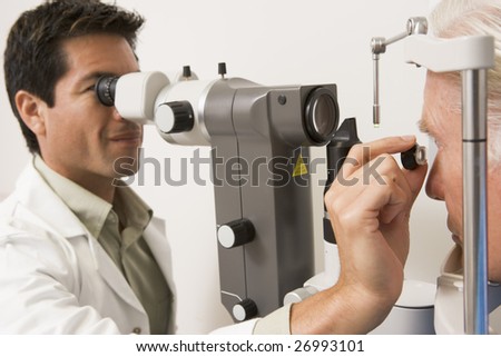 Doctor Looking Through Eye Exam Machine
