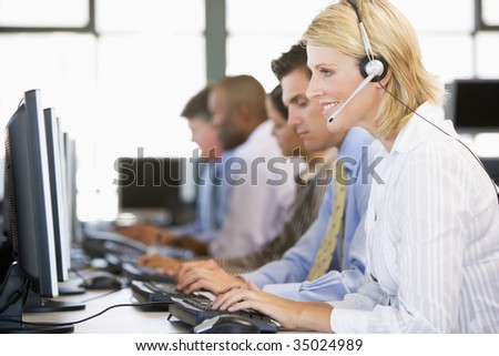 Stock Traders With Headsets At Work