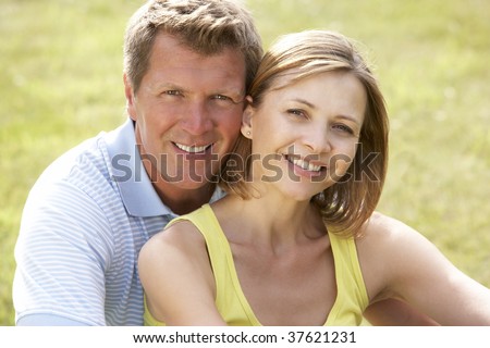 Middle aged couple having fun in countryside