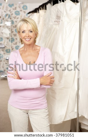 Female sales assistant in bridalwear store