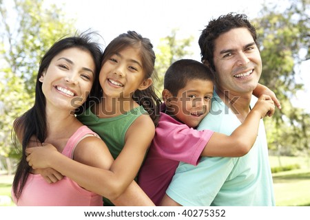 Young Family Having Fun In Park