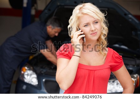 Young woman at auto repair shop