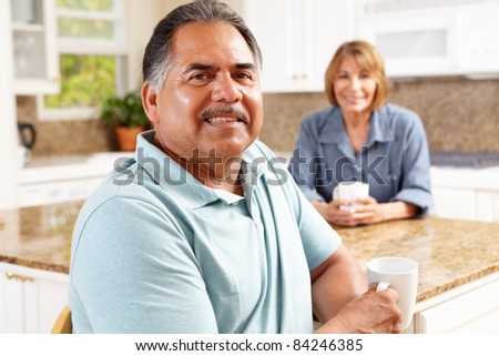 Senior couple relaxing in kitchen
