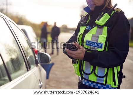 Female Traffic Police Officer Recording Details Of Road Traffic Accident On Mobile Phone Сток-фото © 