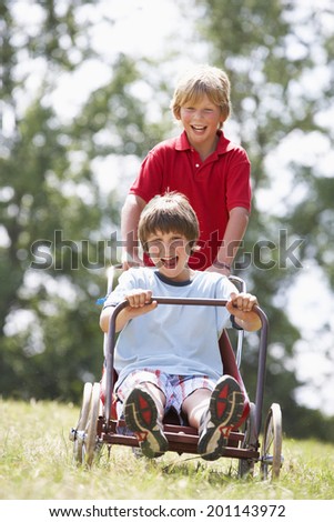 Young boys playing with go-kart