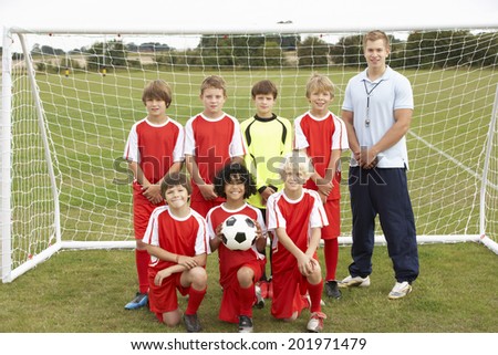 Junior football team and coach portrait