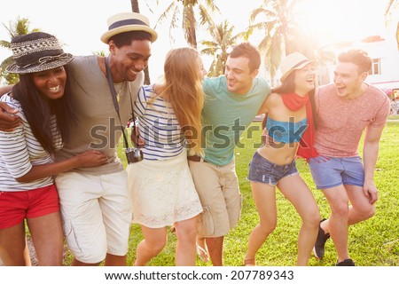 Group Of Friends Having Fun In Park Together