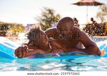 Similar – Image, Stock Photo Active senior man swimming and splashing in water