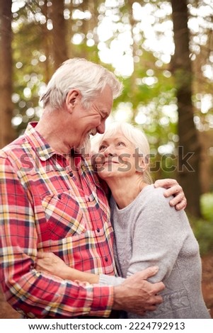 Similar – Image, Stock Photo Senior couple hugging outdoors in autumn