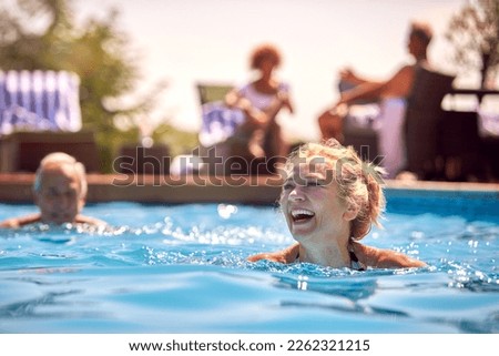 Image, Stock Photo Mature couple swimming together in fresh water