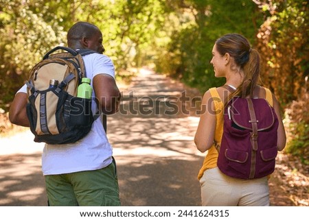 Similar – Image, Stock Photo Couple is walking along the ocean