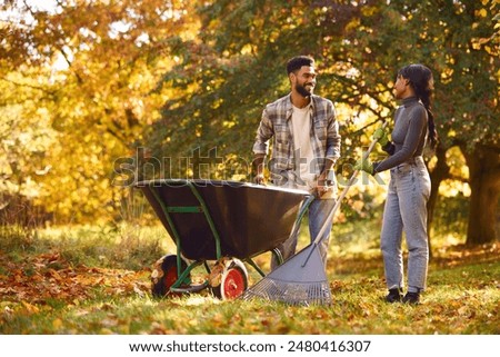 Similar – Image, Stock Photo Leaf rake in autumn on the meadow