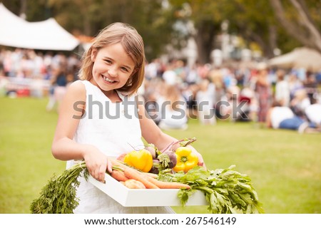 Girl With Fresh Produce Bought At Outdoor Farmers Market